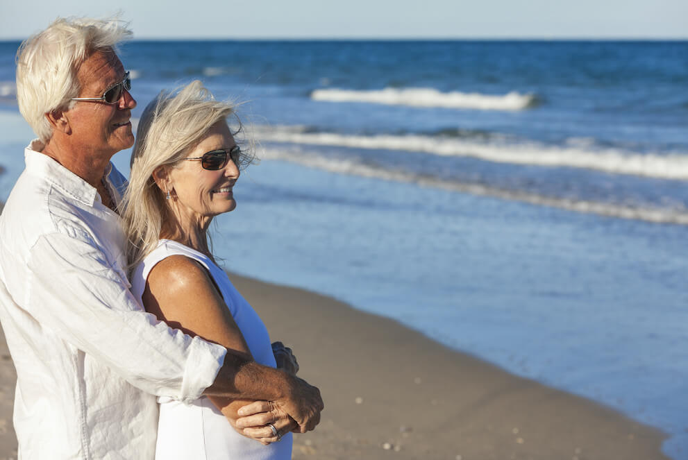 Older Couple Embracing on Beach