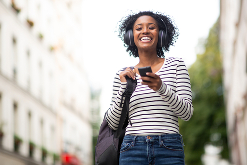 Woman with headphones smiling