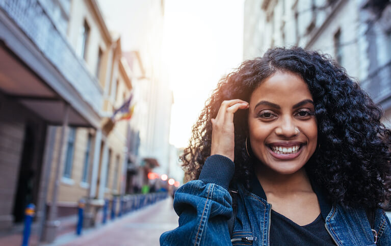 Woman smiling on city street