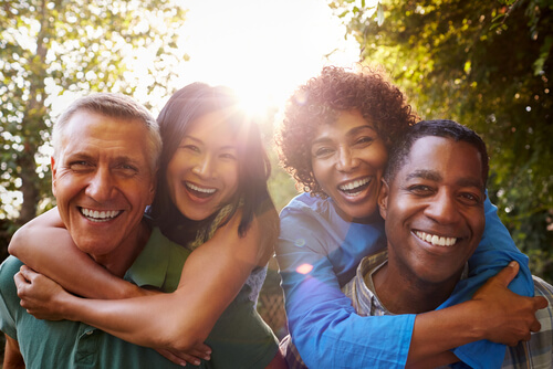 Two couples having fun in the park