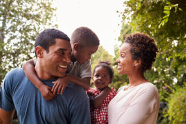 Young African-American family in park