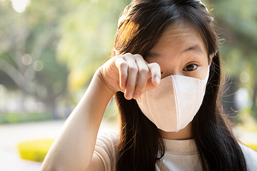 Young Asian woman with dry eye